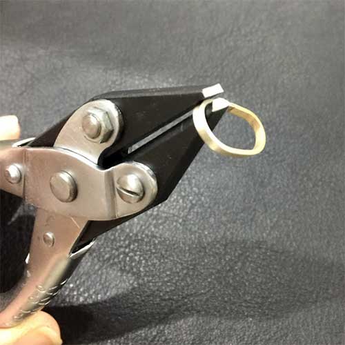 Half round flat nose pliers in use